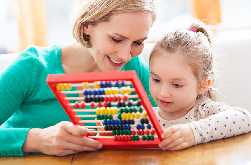 Friendly educator interacting with child at Play & Stay Family Day Care, Goulburn NSW
